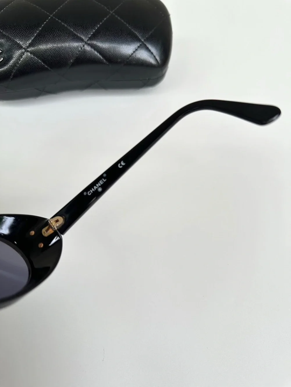 CHANEL Vintage 1990’s Oval Black Sunglasses with Gold CC Emblem